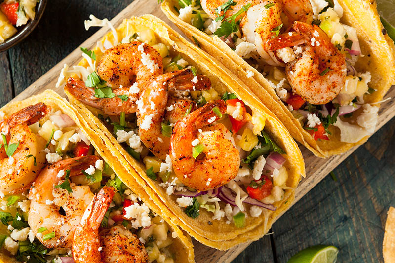 Smoked Cajun lime shrimp tacos on a Duluth Forge kamado grill